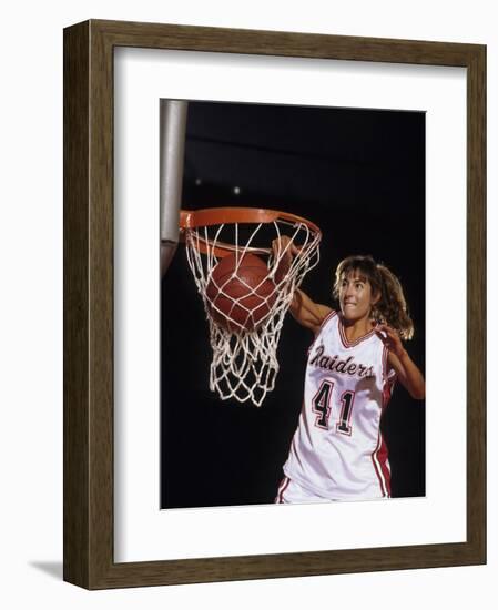 Female Basketball Player Dunking a Ball Through the Hoop-null-Framed Photographic Print