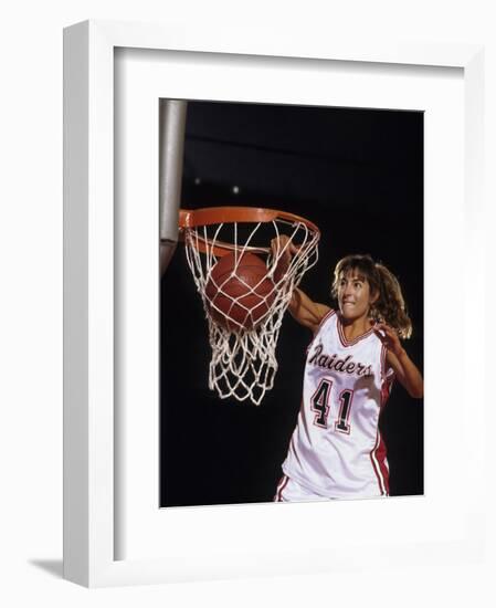 Female Basketball Player Dunking a Ball Through the Hoop-null-Framed Photographic Print