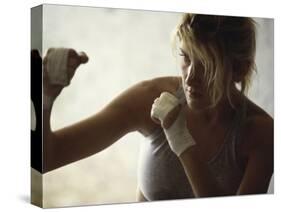 Female Boxer Practicing-null-Stretched Canvas