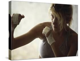 Female Boxer Practicing-null-Stretched Canvas