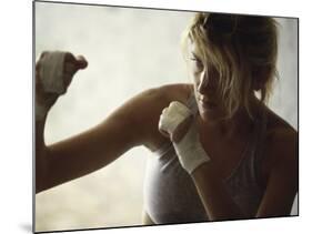 Female Boxer Practicing-null-Mounted Photographic Print