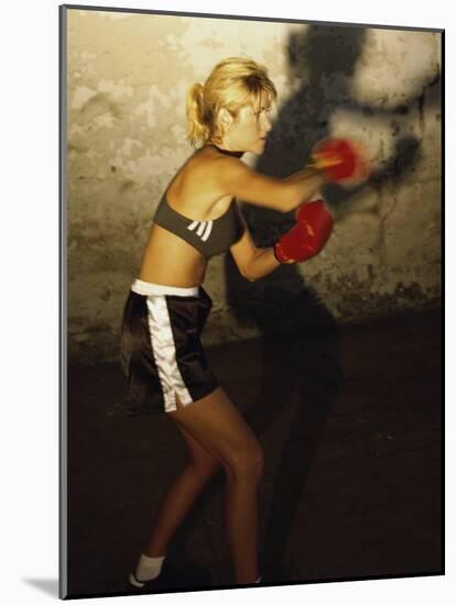 Female Boxer Practicing-null-Mounted Photographic Print