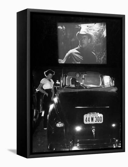 Female Car-Hop Taking Order from Couple in Convertible Car During Movie at Rancho Drive in Theater-Allan Grant-Framed Stretched Canvas