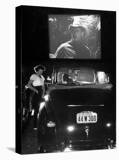 Female Car-Hop Taking Order from Couple in Convertible Car During Movie at Rancho Drive in Theater-Allan Grant-Stretched Canvas