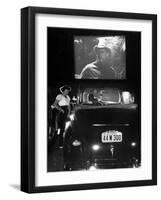 Female Car-Hop Taking Order from Couple in Convertible Car During Movie at Rancho Drive in Theater-Allan Grant-Framed Premium Photographic Print