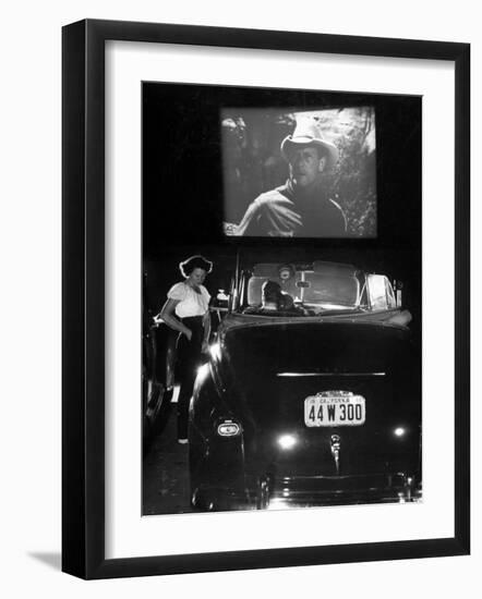 Female Car-Hop Taking Order from Couple in Convertible Car During Movie at Rancho Drive in Theater-Allan Grant-Framed Photographic Print