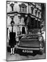 Female Chauffeur Standing by a 1964 Morris Oxford, 1964-null-Mounted Photographic Print