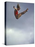 Female Diver Flying Through the Air, California, USA-Paul Sutton-Stretched Canvas