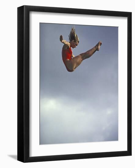 Female Diver Flying Through the Air, California, USA-Paul Sutton-Framed Photographic Print