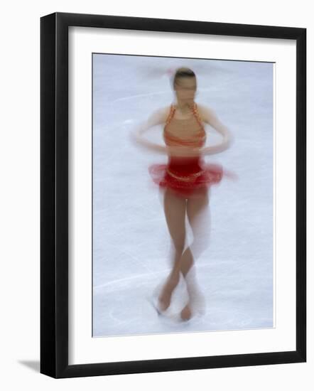 Female Figure Skater Preforming a Spin-null-Framed Photographic Print