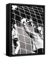 Female Goalie Attempting to Stop a Soccer Ball-null-Framed Stretched Canvas