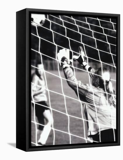 Female Goalie Attempting to Stop a Soccer Ball-null-Framed Stretched Canvas