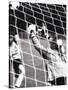 Female Goalie Attempting to Stop a Soccer Ball-null-Stretched Canvas