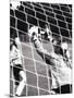 Female Goalie Attempting to Stop a Soccer Ball-null-Mounted Photographic Print