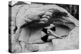 Female gymnast in desert, Overton, Nevada, USA-Pete Saloutos-Stretched Canvas