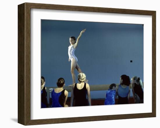 Female Gymnast Performing on a Balance Beam-null-Framed Photographic Print