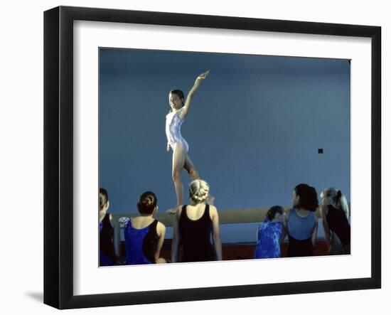 Female Gymnast Performing on a Balance Beam-null-Framed Photographic Print