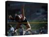 Female High Jumper Clearing a Bar-null-Stretched Canvas