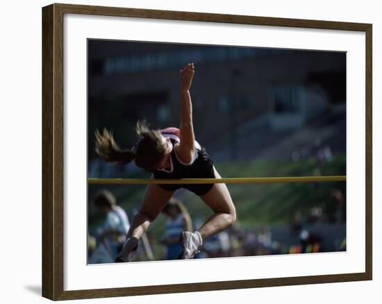 Female High Jumper Clearing a Bar-null-Framed Photographic Print