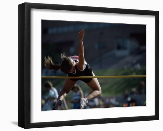 Female High Jumper Clearing a Bar-null-Framed Photographic Print