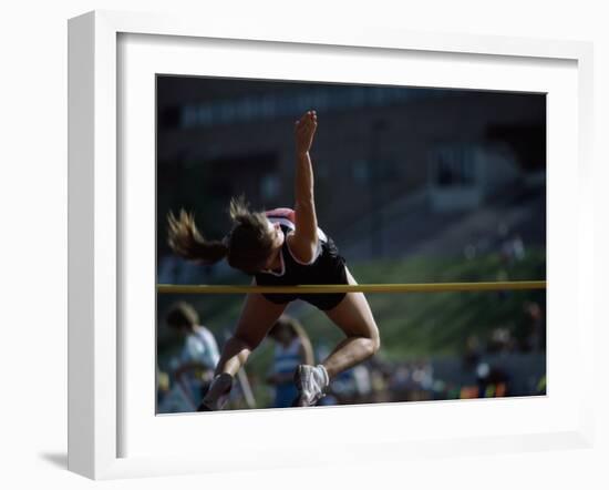 Female High Jumper Clearing a Bar-null-Framed Photographic Print