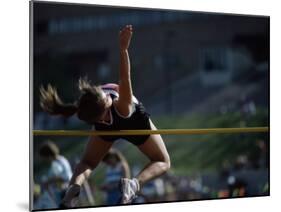 Female High Jumper Clearing a Bar-null-Mounted Photographic Print