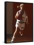 Female High School Basketball Player in Action During a Game-null-Framed Stretched Canvas