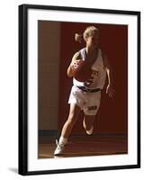 Female High School Basketball Player in Action During a Game-null-Framed Photographic Print