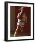 Female High School Basketball Player in Action During a Game-null-Framed Photographic Print