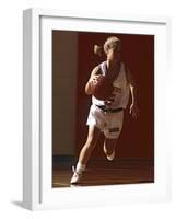 Female High School Basketball Player in Action During a Game-null-Framed Photographic Print