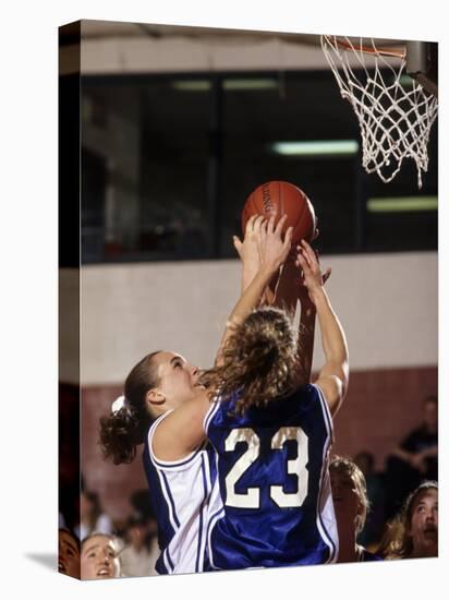 Female High School Basketball Players in Action During a Game-null-Stretched Canvas