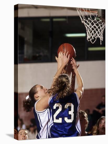 Female High School Basketball Players in Action During a Game-null-Stretched Canvas