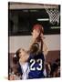 Female High School Basketball Players in Action During a Game-null-Stretched Canvas