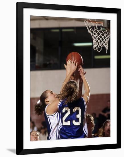 Female High School Basketball Players in Action During a Game-null-Framed Photographic Print