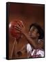 Female High Schooll Basketball Player in Action Shooting a Free Throw During a Game-null-Framed Stretched Canvas