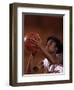 Female High Schooll Basketball Player in Action Shooting a Free Throw During a Game-null-Framed Photographic Print