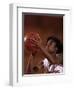 Female High Schooll Basketball Player in Action Shooting a Free Throw During a Game-null-Framed Photographic Print