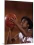 Female High Schooll Basketball Player in Action Shooting a Free Throw During a Game-null-Mounted Photographic Print