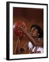 Female High Schooll Basketball Player in Action Shooting a Free Throw During a Game-null-Framed Photographic Print