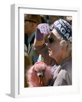 Female Holding Pink Poodle Wearing Hat Emblazoned with Reagan During Campaign Speech-Bill Ray-Framed Photographic Print
