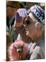 Female Holding Pink Poodle Wearing Hat Emblazoned with Reagan During Campaign Speech-Bill Ray-Mounted Photographic Print