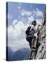 Female Mountain Climber Looking Up-null-Stretched Canvas