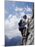 Female Mountain Climber Looking Up-null-Mounted Photographic Print