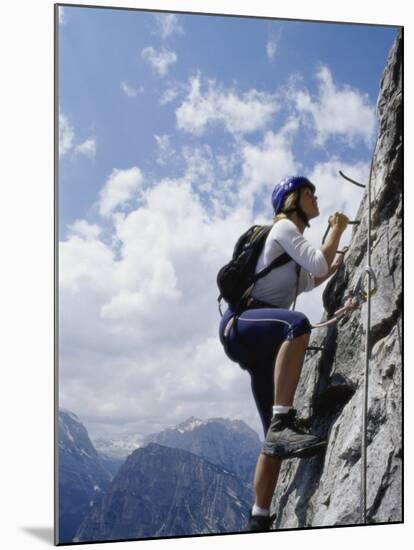 Female Mountain Climber Looking Up-null-Mounted Photographic Print