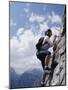 Female Mountain Climber Looking Up-null-Mounted Photographic Print