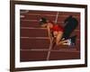 Female Runner at the Start of a Track Race-null-Framed Photographic Print