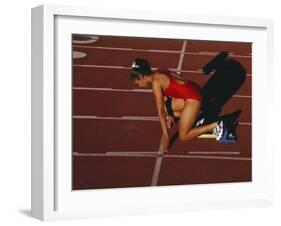 Female Runner at the Start of a Track Race-null-Framed Photographic Print