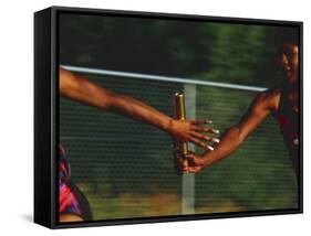 Female Runner Competing in a Relay Track Race-null-Framed Stretched Canvas