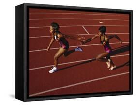 Female Runner Competing in a Relay Track Race-null-Framed Stretched Canvas