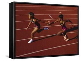 Female Runner Competing in a Relay Track Race-null-Framed Stretched Canvas